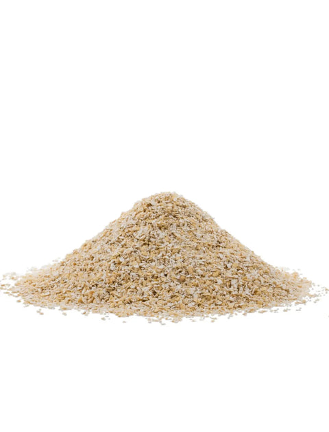 A small mound of coarse, light tan granules or powder, resembling ground coffee or spice, centered on a solid white background.