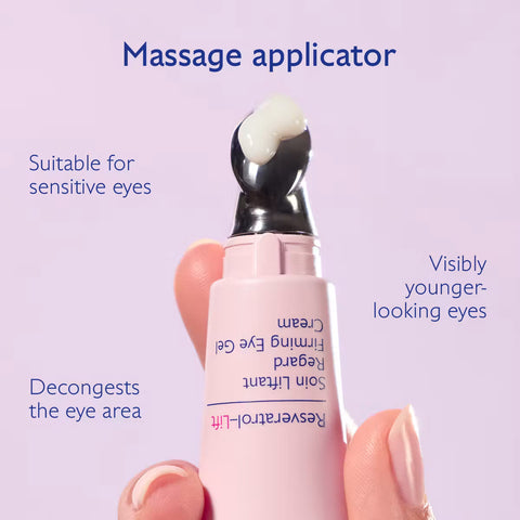 A hand holding a pink eye cream tube with a black applicator tip coated in white gel, set against a light lavender background with promotional text about massage applicator benefits.