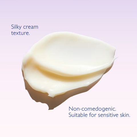 A dollop of creamy off-white skincare cream with text overlays reading 'Silky cream texture.' and 'Non-comedogenic.