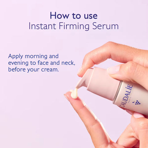 A hand pumps a pale cream serum from a light pink bottle onto another finger, with text reading 'How to use Instant Firming Serum' on a soft lavender background.