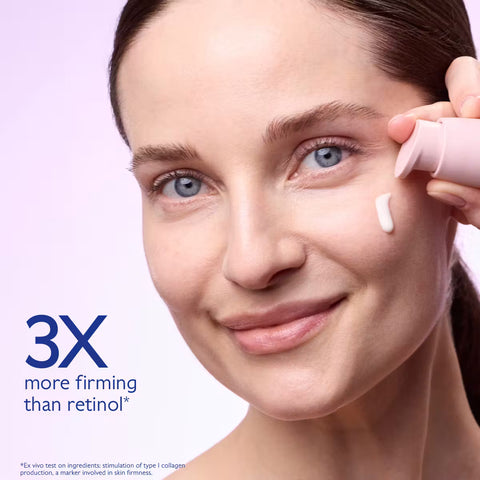 Close-up of a woman applying cream from a pink tube to her cheek, with text reading '3X more firming than retinol & non-irritating' on a pale lavender background.