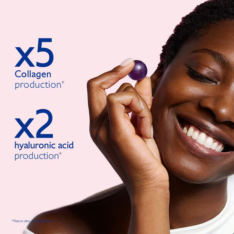 Woman holding a purple berry with text about collagen and hyaluronic acid production on a pink background