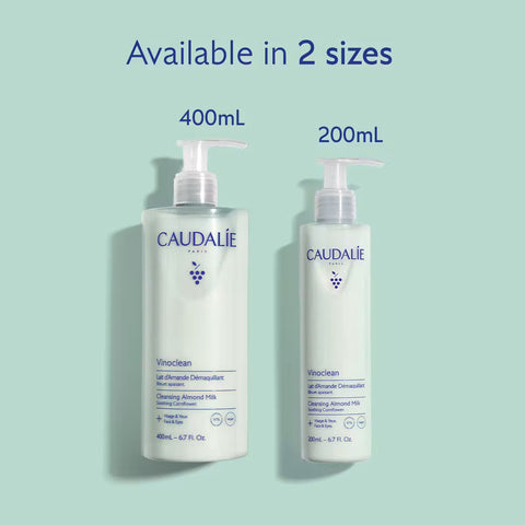 Two bottles of Caudalie Vinclean cleansing almond milk shown on a pale mint background, labeled 400mL and 200mL, with the text 'Available in 2 sizes' above them.