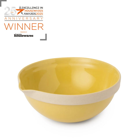 Yellow bowl with beige accent on a white background, featuring 'Excellence in Housewares Awards 2025' text.