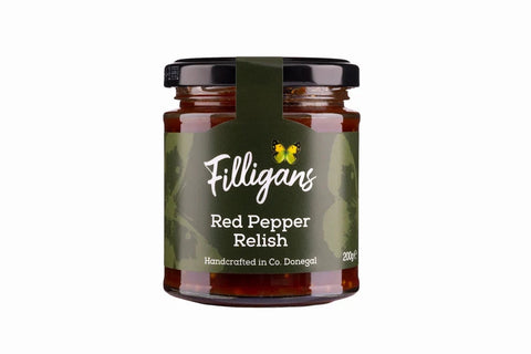 A glass jar of Filligans Red Pepper Relish with a dark olive green label and black lid, shown on a plain white background.