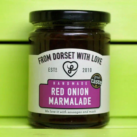 A jar of From Dorset With Love Red Onion Marmalade, featuring a white label with a purple accent block and a black lid, set against a bright lime green background.