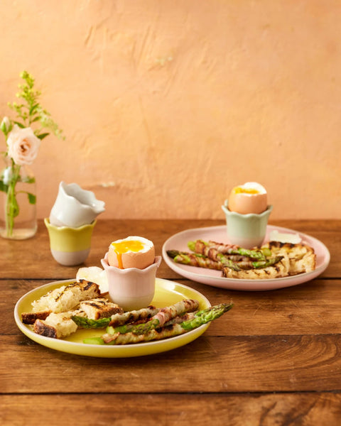 Plates of food on a wooden table with a warm background