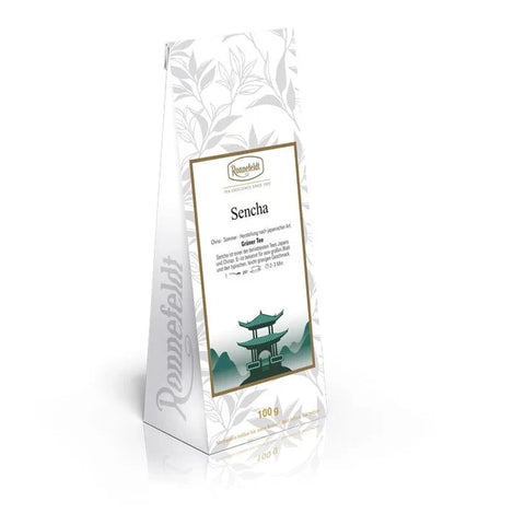 A 100g stand-up pouch of Ronafelt Green Vanilla loose-leaf tea, featuring a white package with elegant gray botanical patterns, a central white label with a gold border, and a green pagoda illustration.