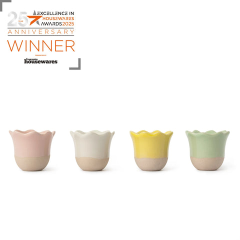 Four colorful ceramic cups with a '25th Anniversary Winner' label on a white background