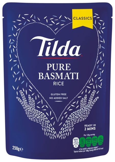 A 250g stand-up pouch of Tilda Pure Basmati Rice, Classics flavor, in a deep blue packaging with white text and illustrations of hands holding rice grains.